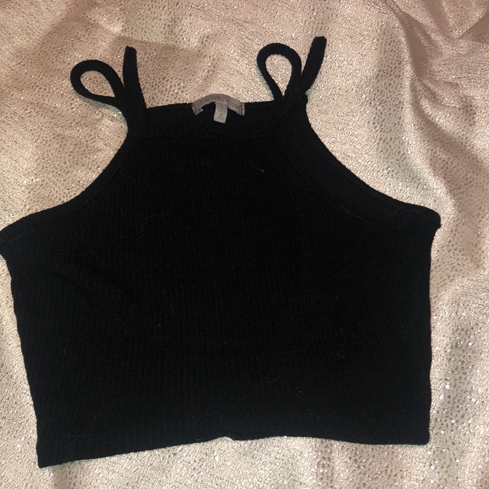 Black crop top. Shorter than most crop tops